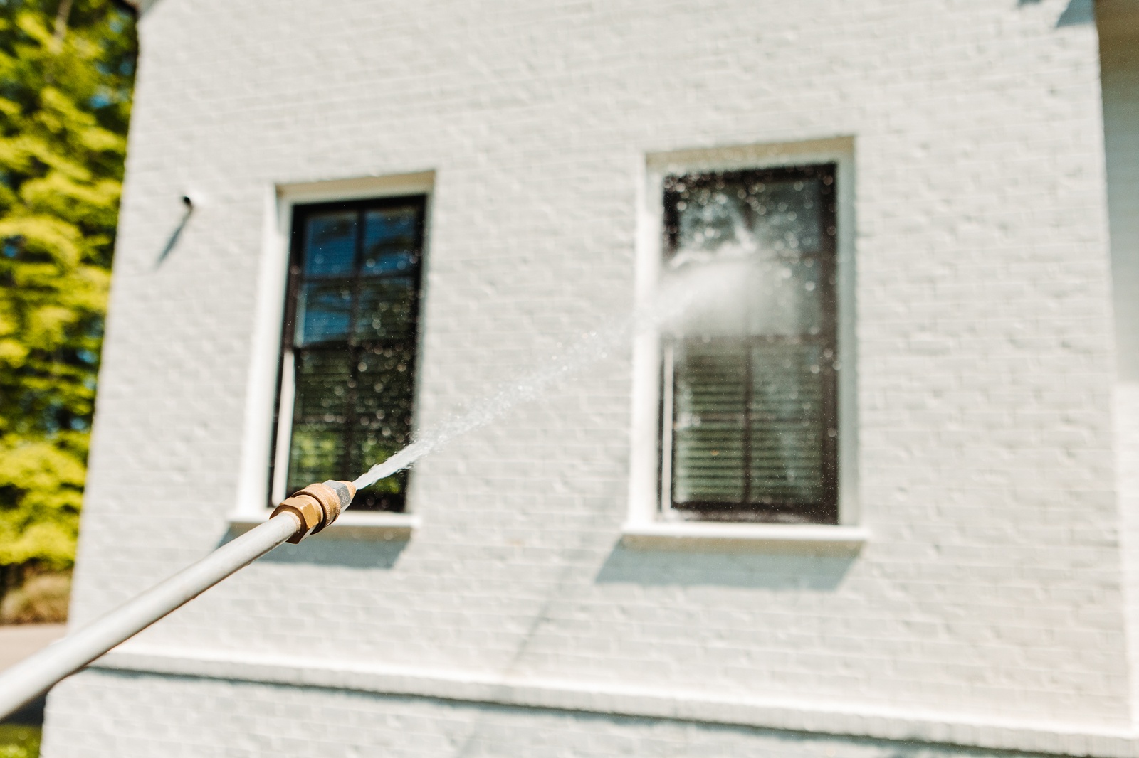 Pressure Washer Cleaning Exterior Windows And Brick Zapp It Power Washing